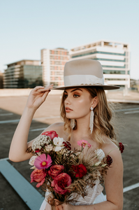 Handmade wedding hat by Remi Wylder in bone felt 